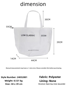 White canvas tote bag detail showing internal zipper pocket and printed LOW CLASSIC logo