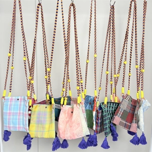 Retro plaid crossbody phone bag with woven strap, yellow buckle and purple fringe detail