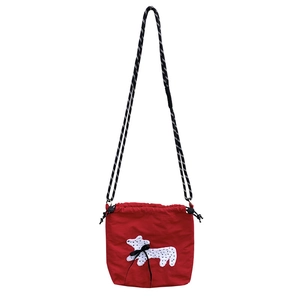 Red nylon crossbody bag featuring a white embroidered terrier and black rope strap