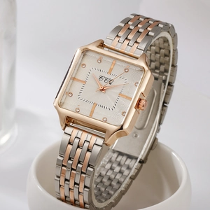 Detailed close-up of a square quartz watch dial with rose gold accents and crystal markers