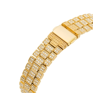 Detail view of a gold-plated link bracelet fully paved with sparkling cubic zirconia crystals