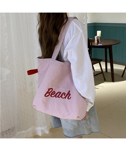Pink nylon Beach print tote bag shown from a back view to highlight large capacity and style