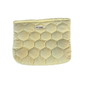 Pale yellow quilted cosmetic bag with soft wave pattern and May Rabbit woven label