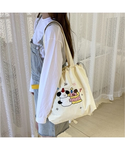 Detail of embroidered Sanrio character on large canvas shoulder bag with drawstring