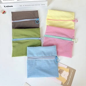 Set of five colorful nylon pouches with square textures and large circular zipper pullers