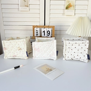 Three quilted storage baskets with bear, cat, and heart floral prints for desk organizing