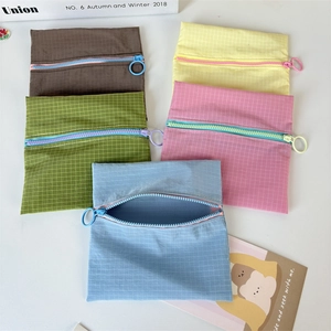 Waterproof nylon mini pouches set in five colors with grid texture and ring zipper