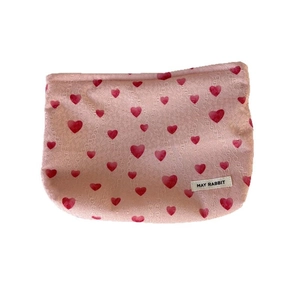 Pink heart print canvas makeup bag with large capacity and May Rabbit label on white background