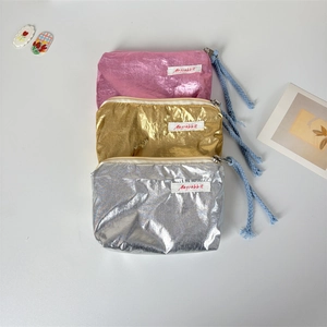 Three-piece metallic shiny makeup pouch set in pink, gold, and silver finishes