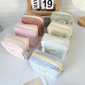 Minimalist plaid fabric cosmetic bag with zipper and May Rabbit label in multiple colors
