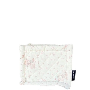 Quilted floral storage basket with bunny print and May Rabbit tag on white background