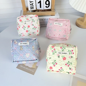 Quilted cotton mini pouch collection in floral and cartoon prints with May Rabbit label