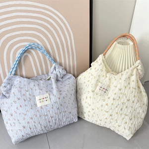 Floral chiffon tote bags in light blue and cream with pleated texture and rope handles