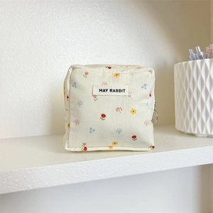 Mini porte-monnaie en tissu fleuri avec fermeture éclair jaune et motif coton