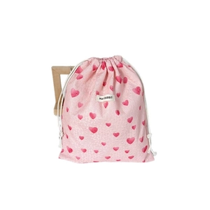 Pink heart drawstring storage bag with textured fabric and red heart patterns