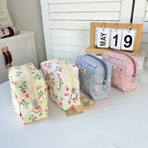 Quilted floral mini makeup bags with cartoon rabbit patterns in four pastel colors