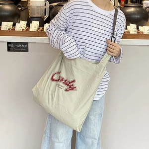 Green and white checkered canvas tote bag with red Candy logo and large capacity