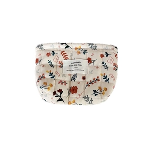 Quilted floral makeup bag with large capacity and vintage aesthetic on white background