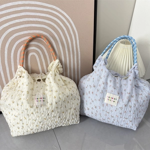 Floral chiffon shoulder bag with pleated texture and colorful braided rope handles