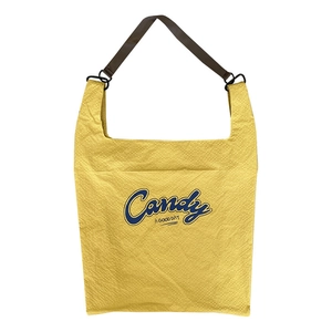 Fashionable yellow nylon tote bag with blue Candy letter print and brown shoulder straps