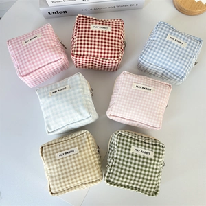 Detailed grid showing seven colors of cotton gingham pouches with zippers and cloth labels