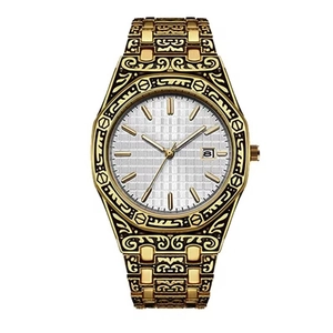 Macro detail of golden men's watch featuring intricate floral engravings and date window