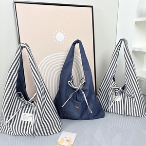 Minimalist retro striped tote bag set with bow detail in various colors and textures