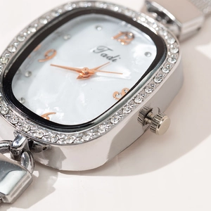 Elegant oval quartz watch for women with diamond bezel and silver mesh strap