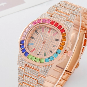 Detail view of rose gold luxury watch featuring rainbow zircon bezel and pave crystals