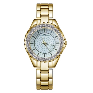 Montre élégante dorée pour femme avec lunette en strass et bracelet en métal étoilé