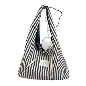 Retro striped canvas tote bag with black and white vertical stripes and bow tie detail