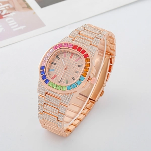 Macro detail of luxury rose gold watch with rainbow crystal bezel and full diamond strap