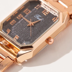 Montre à quartz élégante pour femme avec bracelet en acier or rose et cadran étoilé noir