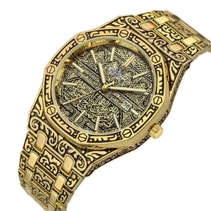 Luxury gold men's watch with octagonal bezel and intricate Arabic style floral engraving
