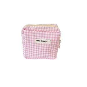 Pink checkered mini makeup bag with zipper closure and woven decorative label
