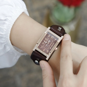 Elegant H-shape women's watch with rhinestone case, brown leather strap, and metal studs