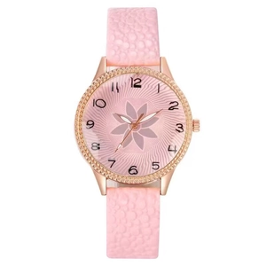 Women's pink quartz watch with rose gold rhinestone bezel and floral patterned dial