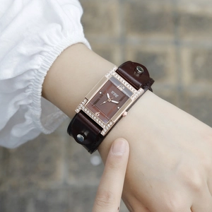 Vintage rectangular rose gold watch with rhinestone bezel and brown wide leather cuff strap