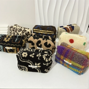 Portable plush makeup bags in leopard and checkered patterns with soft fleece texture