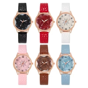 Macro shot showing six colors of women's quartz watches with floral dial and crystal bezel