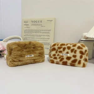 Set of two plush leopard and brown makeup pouches with soft faux fur texture for storage