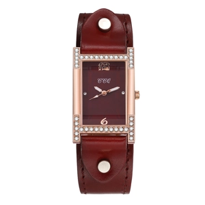 Detail of vintage square quartz watch with diamond markers and wide red leather strap