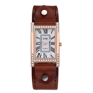 Detailed macro view of retro rectangular quartz watch with crystal rose gold case