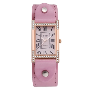 Detail of rose gold rectangular watch with crystal inlay and pink leather strap
