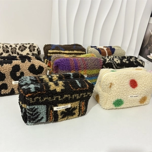 Detailed view of plush lamb fleece textures and Bohemian patterns on various pouches