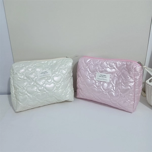 Quilted heart pattern PU leather cosmetic bags in cream white and light pink colors