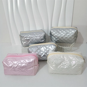 Detail of multi-style PU waterproof toiletry bags with heart and checkered quilting patterns