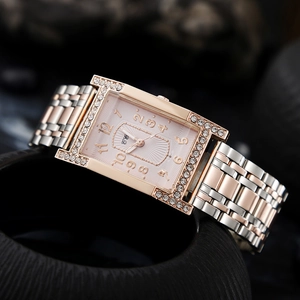 Detail of rose gold rectangular watch case with double-row crystals and pink dial
