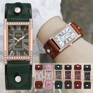 Detail of rectangular rose gold quartz watch with rhinestones and multi-color leather straps
