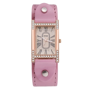 Detail of rectangular rose gold watch with pink leather strap and crystal embellishments